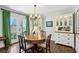 Bright dining room featuring hardwood floors, a round table, and natural light at 111 Terrace Ne Dr, Atlanta, GA 30305