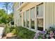 Exterior detail showcasing large windows, hydrangeas, and the architectural design of this home at 111 Terrace Ne Dr, Atlanta, GA 30305