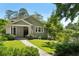 Charming home featuring a well-maintained front yard with lush green grass and stone pathway at 111 Terrace Ne Dr, Atlanta, GA 30305