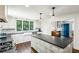 Eat-in kitchen with white cabinetry, stone counters, stainless appliances, and large island at 111 Terrace Ne Dr, Atlanta, GA 30305