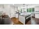Bright eat-in kitchen with large island, black countertops, white cabinetry and stainless steel appliances at 111 Terrace Ne Dr, Atlanta, GA 30305