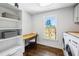 Laundry room with built-in shelves and a desk at 111 Terrace Ne Dr, Atlanta, GA 30305