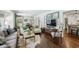 Spacious living room with hardwood floors, ample seating, and dining area at 111 Terrace Ne Dr, Atlanta, GA 30305