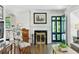 Bright living room with hardwood floors, fireplace, and stylish doorway at 111 Terrace Ne Dr, Atlanta, GA 30305