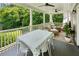 Inviting porch with ample seating and a dining table, perfect for outdoor entertaining at 111 Terrace Ne Dr, Atlanta, GA 30305