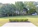 Backyard with green grass, privacy fence, trees and shed in background at 1510 Summer Lake Ter, Loganville, GA 30052