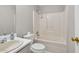 Clean bathroom featuring a shower-tub combo and vanity at 1510 Summer Lake Ter, Loganville, GA 30052