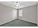 Cozy bedroom with neutral walls, carpet, and a window at 1510 Summer Lake Ter, Loganville, GA 30052