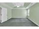 Bedroom with green walls, tray ceiling, ceiling fan, and natural light at 1510 Summer Lake Ter, Loganville, GA 30052