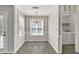 Bright breakfast nook with decorative wallpaper, offering a cozy dining space at 1510 Summer Lake Ter, Loganville, GA 30052