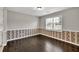 Dining area with wood floors and ample natural light from the window at 1510 Summer Lake Ter, Loganville, GA 30052