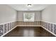 Dining area with wood floors and ample natural light from the window at 1510 Summer Lake Ter, Loganville, GA 30052