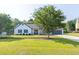 Charming home with stone accents, a well-manicured lawn, and a driveway at 1510 Summer Lake Ter, Loganville, GA 30052