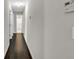 Hallway with wood floors and white walls at 1510 Summer Lake Ter, Loganville, GA 30052