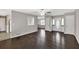 Spacious living room featuring hardwood floors and a view of other rooms through an open layout at 1510 Summer Lake Ter, Loganville, GA 30052