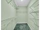 Walk-in closet with lots of white wire shelving and green carpet at 1510 Summer Lake Ter, Loganville, GA 30052
