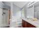 Bright bathroom with double sinks, separate shower, tub, and vanity at 154 Stephens Mill Dr, Dallas, GA 30157