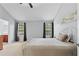 Bright and airy bedroom featuring neutral walls, large windows, and plush carpeting at 154 Stephens Mill Dr, Dallas, GA 30157