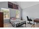 Bedroom with a bed and desk in front of two windows, and decorated with neutral wall color at 154 Stephens Mill Dr, Dallas, GA 30157