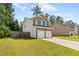 Two-story home with brick and siding, a two-car garage, and a well-kept lawn in a suburban setting at 154 Stephens Mill Dr, Dallas, GA 30157