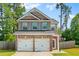Charming two-story brick home with a two-car garage and neatly landscaped front yard at 154 Stephens Mill Dr, Dallas, GA 30157