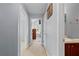Hallway with multiple doorways leading to bedrooms and bathrooms, all painted in a neutral color at 154 Stephens Mill Dr, Dallas, GA 30157