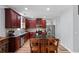 Modern kitchen featuring granite countertops, stainless steel appliances, and an island with bar seating at 154 Stephens Mill Dr, Dallas, GA 30157