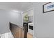 Convenient laundry room with modern washer and dryer units and shelving at 154 Stephens Mill Dr, Dallas, GA 30157