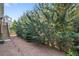 Landscaped backyard with mature trees, a wood staircase, and landscape lighting at 2245 Long Bow Chase, Kennesaw, GA 30144