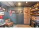 Finished basement custom bar area boasts brick wall, a wood shelf, and stylish decor at 2245 Long Bow Chase, Kennesaw, GA 30144