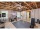 Finished basement with curtains, exercise equipment, and ample space for activities at 2245 Long Bow Chase, Kennesaw, GA 30144