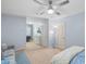 Spacious bedroom features a ceiling fan, space for a desk, and neutral carpet at 2245 Long Bow Chase, Kennesaw, GA 30144