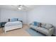This bedroom is spacious with neutral carpet, a bed, and a couch at 2245 Long Bow Chase, Kennesaw, GA 30144