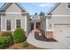 Charming home featuring a manicured front yard, brick accents, and covered entryway at 2245 Long Bow Chase, Kennesaw, GA 30144