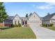 Charming single-Gathering home features a two-car garage, well-manicured lawn, and inviting front porch at 2245 Long Bow Chase, Kennesaw, GA 30144