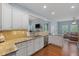 Well-lit kitchen featuring granite countertops, stainless steel appliances and an adjacent living area at 2245 Long Bow Chase, Kennesaw, GA 30144