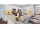 Modern kitchen featuring stainless steel appliances, granite countertops, and ample cabinet space at 2245 Long Bow Chase, Kennesaw, GA 30144