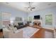 Spacious living room with a brick fireplace, ceiling fan, and plenty of natural light at 2245 Long Bow Chase, Kennesaw, GA 30144