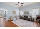 Inviting living room with hardwood floors, a comfortable seating arrangement, and plenty of light at 2245 Long Bow Chase, Kennesaw, GA 30144