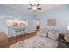 Open-concept living room with a view of the kitchen and dining area, modern decor, and light-colored walls at 2245 Long Bow Chase, Kennesaw, GA 30144