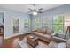 This living room offers natural light, with hardwood floors and a door to the patio at 2245 Long Bow Chase, Kennesaw, GA 30144