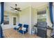 Relaxing porch with ceiling fan, outdoor grill, string lights, and comfortable seating at 2245 Long Bow Chase, Kennesaw, GA 30144