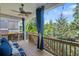 Relaxing covered porch with wooded view and comfortable seating at 2245 Long Bow Chase, Kennesaw, GA 30144