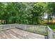 Charming back deck overlooking the lush green backyard at 3223 Heritage Way, Buford, GA 30519