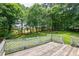 Back deck overlooking the lush green backyard at 3223 Heritage Way, Buford, GA 30519