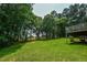 Spacious backyard with lush greenery and trees at 3223 Heritage Way, Buford, GA 30519