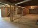 View of unfinished basement with framed walls, perfect for future customization and added living space at 3223 Heritage Way, Buford, GA 30519