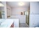 Bright bathroom featuring a shower, a window, and built-in storage at 3223 Heritage Way, Buford, GA 30519