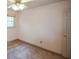 This bedroom features neutral walls, a ceiling fan, and natural light at 3223 Heritage Way, Buford, GA 30519