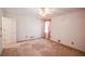 Light-filled bedroom with neutral walls, a ceiling fan, and a window at 3223 Heritage Way, Buford, GA 30519